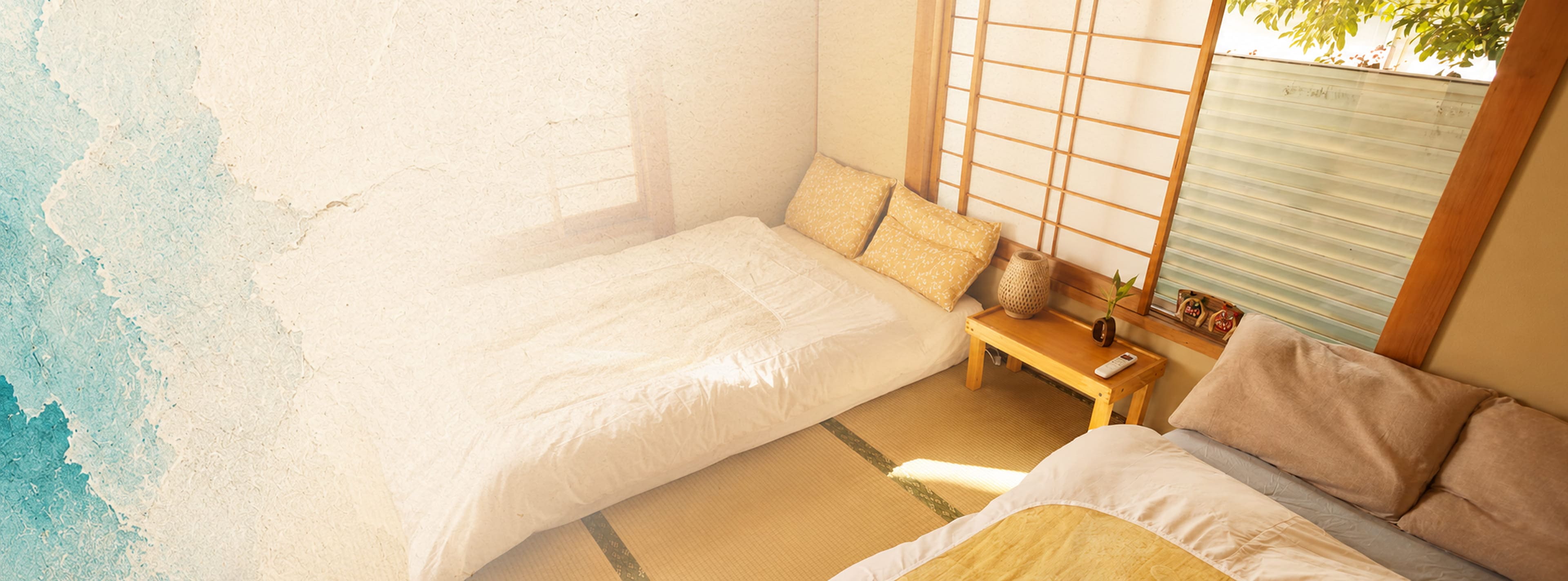 Traditional Japanese oni masks beside a warm lamp